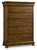 Hooker Furniture Archivist Six-Drawer Chest, a wooden bedroom storage unit with a classic brown finish, five spacious drawers with round black metal knobs, and a molded top design.