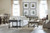 Hooker Furniture Ciao Bella Cocktail Table, living room with a mix of modern and rustic furniture including a white sofa, side tables, and a coffee table with a light-colored top and black legs.