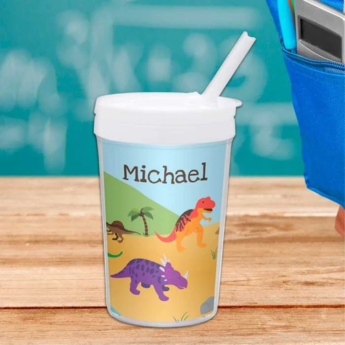 Spark & Spark Dinosaurs In The Jungle Toddler Cup, personalized with the name Michael, featuring colorful dinosaur illustrations and a straw.