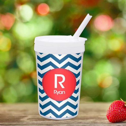 Spark & Spark Chevron Navy And Red Toddler Cup, white plastic cup with a chevron navy and red pattern, a red circular monogram with the letter R and the name Ryan, and a white lid with a straw.