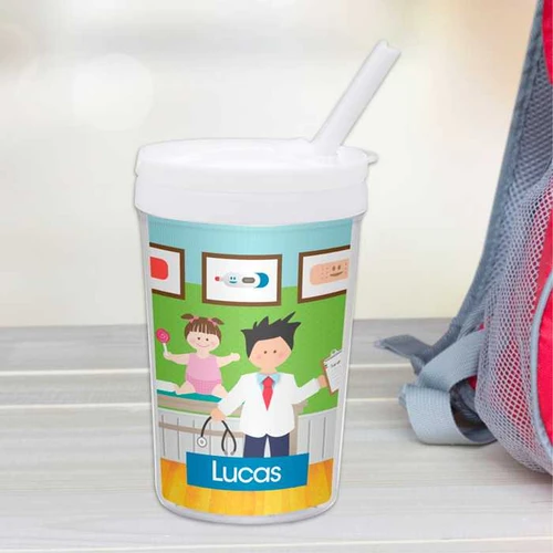 Spark & Spark Boy Doctor's Visit Toddler Cup, designed with a colorful illustration of a boy doctor holding a clipboard and a young girl patient holding a lollipop, personalized with the name Lucas.