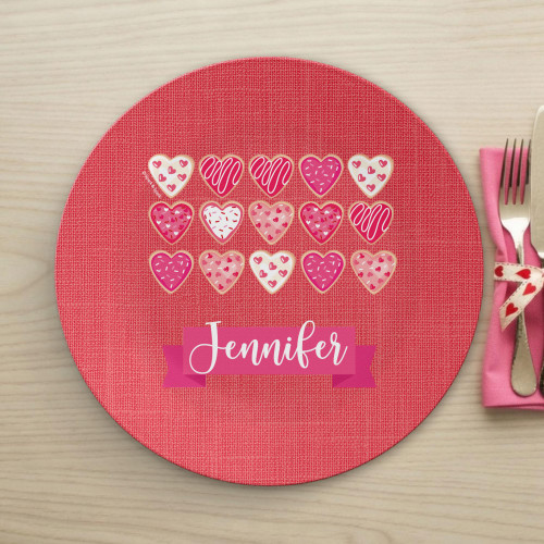 Spark & Spark Full of Hearts Kids Placemat, red textured placemat with colorful heart patterns and the name Jennifer written on it.