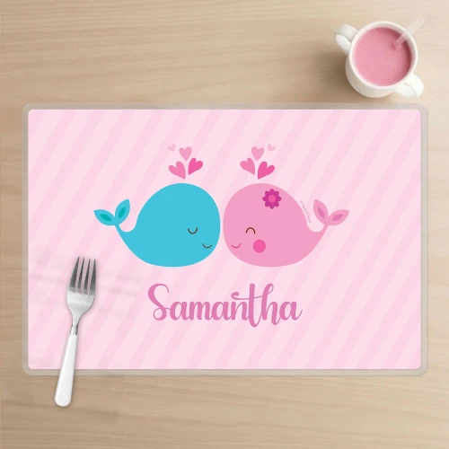 Spark & Spark Whales in Love Kids Placemat, pink and blue cartoon whales with hearts and the name 'Samantha' on a pink striped background.