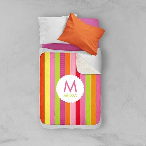 Spark & Spark Bold & Fun Stripes Sherpa Blanket, colorful striped blanket with the name Melissa embroidered, shown on a bed with pillows.