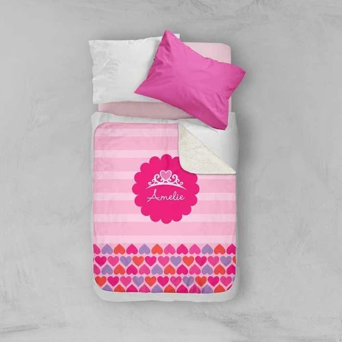 Spark & Spark I am a Pretty Princess Sherpa Blanket with pink and red hearts design and customizable name print, on a bed with white and pink pillows.