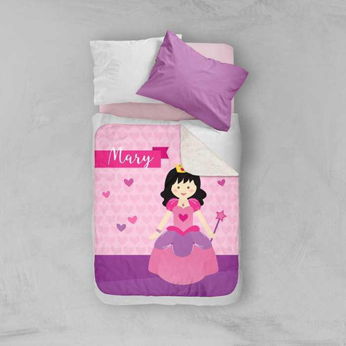 Spark & Spark Cute Princess Sherpa Blanket, pink baby blanket with princess girl graphic and name 'Mary' on bed with purple pillow and white pillow.