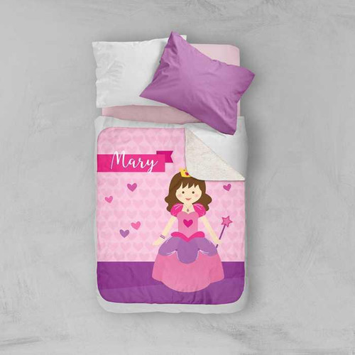 Spark & Spark Cute Princess Sherpa Blanket, pink blanket with a cartoon princess design, personalized with the name Mary, on a bed with purple and white pillows.