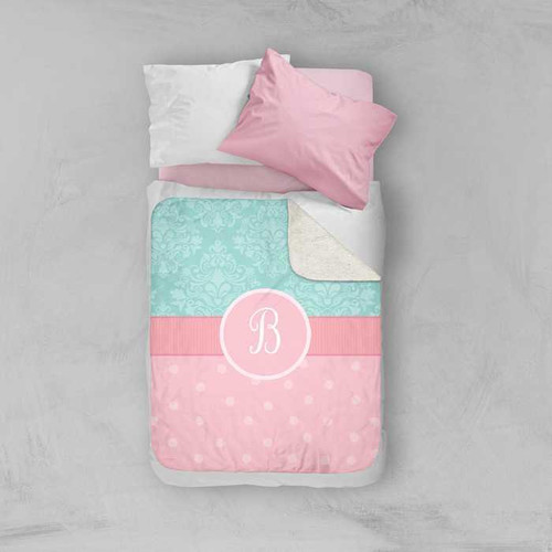 Spark & Spark Pretty Blue Damask Sherpa Blanket, pink and blue blanket with damask pattern and monogrammed letter B on a bed with pillows.