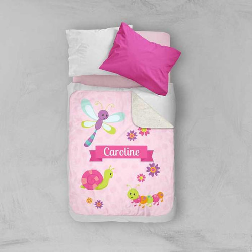 Spark & Spark Three Sweet Little Bugs Sherpa Blanket, pink kids' blanket with colorful bug and flower prints, personalized with the name Caroline.