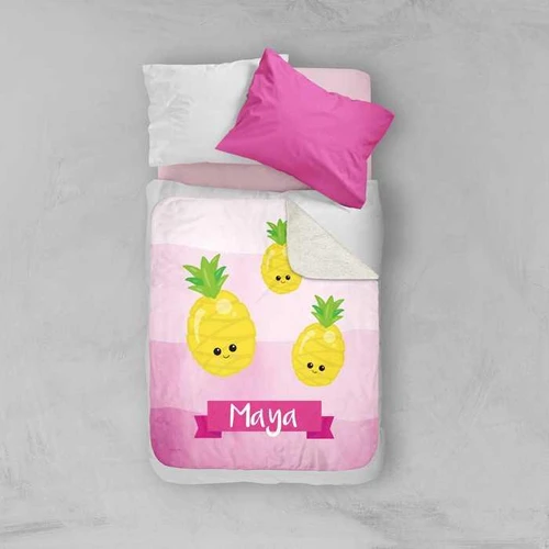 Spark & Spark Yummy Pineapples Sherpa Blanket with cute pineapple design and personalized name 'Maya' on pink background, on a bed with pillows.