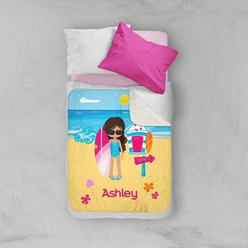 Spark & Spark Beach Girl Sherpa Blanket, colorful beach-themed design with girl holding surfboard on a sandy beach with ocean and sky background, personalized with the name Ashley.
