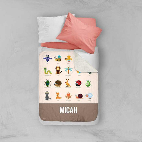 Spark & Spark Sweet Animal Chart Brown Sherpa Blanket with colorful animal illustrations and personalized name Micah on the bottom
