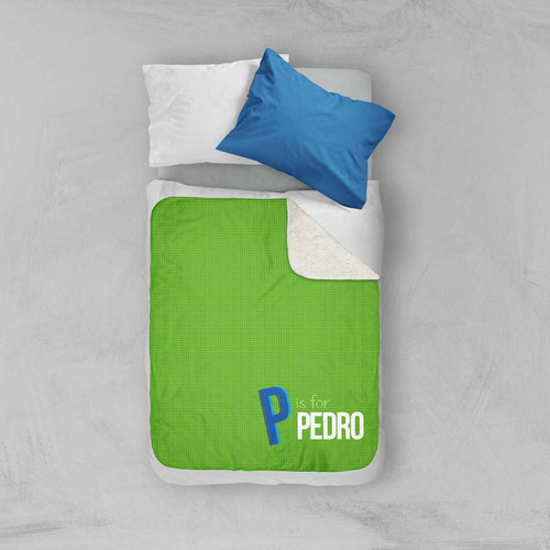 Spark & Spark Double Initial - Green Sherpa Blanket, vibrant green sherpa blanket with a personalized initial and name, on a neatly made bed with white and blue pillows.