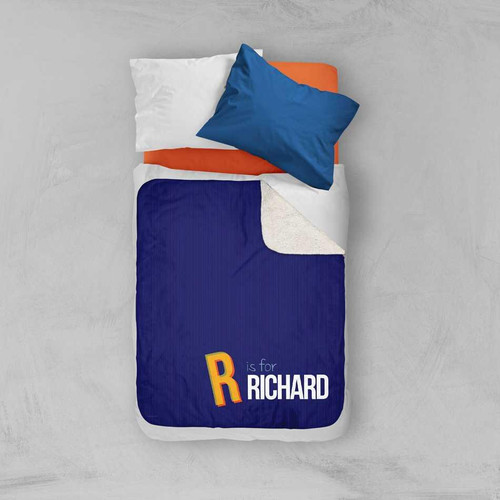 Spark & Spark Double Initial - Blue Sherpa Blanket, a cozy blue sherpa blanket with a personalized letter R and name Richard, placed on a bed with pillows.