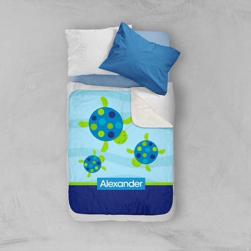 Spark & Spark Swimming Blue Turtle Sherpa Blanket, a cozy blanket featuring adorable blue and green turtle designs, personalized with the name Alexander.