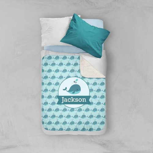 Spark & Spark Sweet Little Blue Whale Pattern Sherpa Blanket, a soft baby blanket with a adorable blue whale design and customizable name 'Jackson' on it.