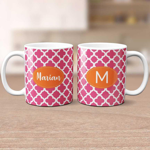 Spark & Spark Quatrefoil Beauty Ceramic Mug set, pink and white quatrefoil design with personalized orange oval labels showing 'Marian' and 'M'.