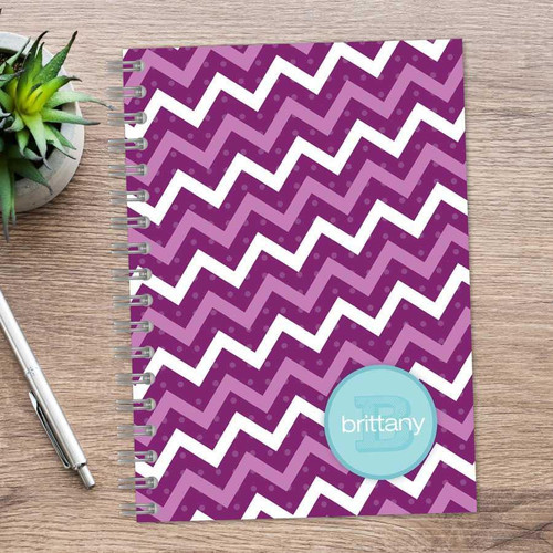 SparkGreetings® Mod Chevrons Writing Journal, purple chevron pattern with polka dots and a personalized blue name label on the cover.