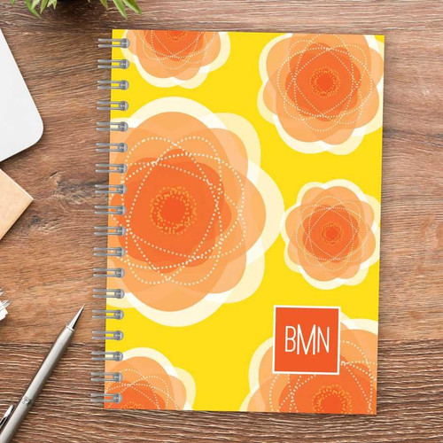 SparkGreetings® Pretty Blooms Writing Journal, vibrant yellow cover with orange and peach floral pattern and BMN logo.