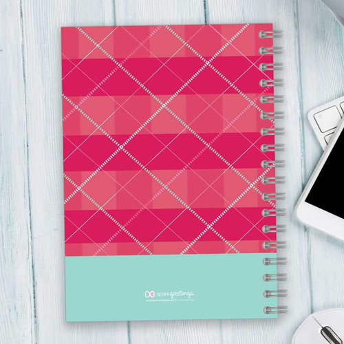SparkGreetings® Criss Cross Writing Journal, pink and red plaid design with white criss-cross lines and a light blue bottom section.
