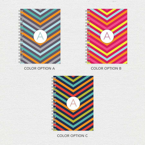 SparkGreetings® Style in Stripes Writing Journal, colorful striped chevron pattern in three options with spiral binding and a white circular label with red 'A' on the cover.