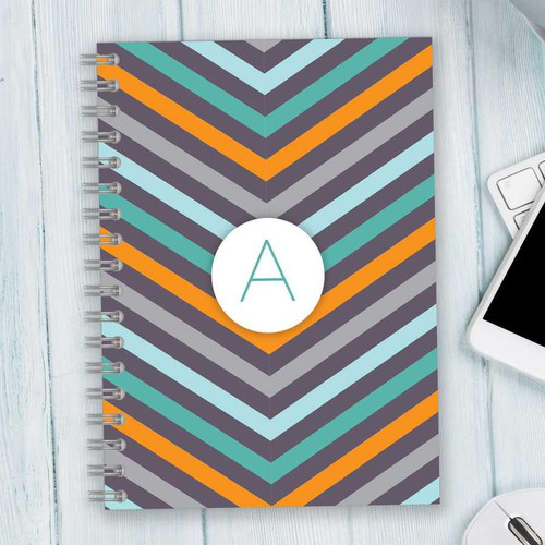SparkGreetings® Style in Stripes Writing Journal, colorful chevron pattern on the cover with a personalized initial 'A' in a white circle.