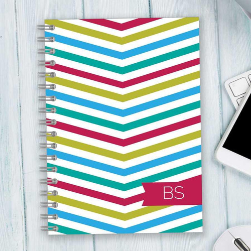 SparkGreetings® Beautiful Colors Writing Journal, notebook with colorful chevron striped cover design in red, green, blue, and white.