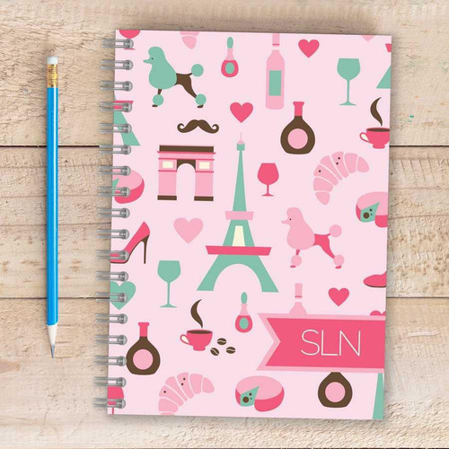 SparkGreetings® Paris Chic Style Writing Journal, pink themed Parisian-themed design with Eiffel Tower, dogs, wine glasses, coffee cups, hearts, and perfume bottles illustrations.