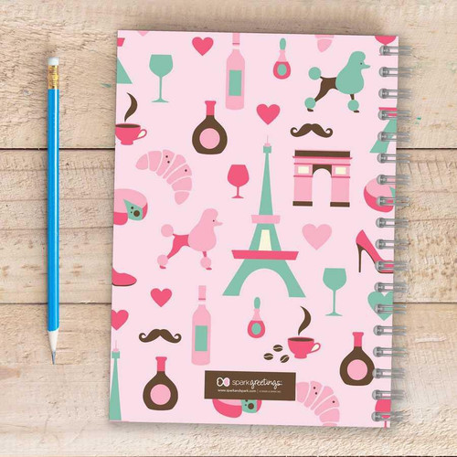 SparkGreetings® Paris Chic Style Writing Journal, pink patterned journal with Eiffel Tower, wine bottles, wine glasses, croissants, poodles, high heel shoe, and lover's symbols.