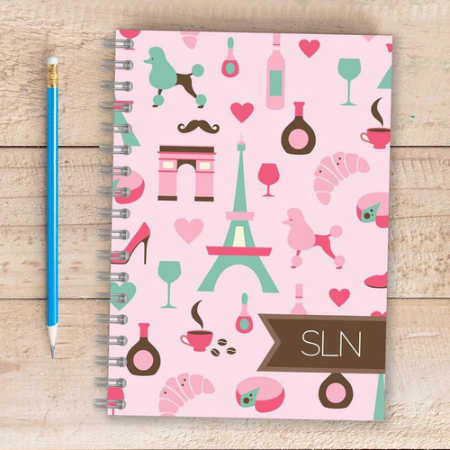 SparkGreetings® Paris Chic Style Writing Journal, pink-themed Parisian and French-inspired illustrations including Eiffel Tower, wine glass, croissant, coffee cup, perfume bottles, and hearts on the cover.