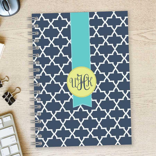 SparkGreetings® Simple Geometry Writing Journal, navy blue cover with white geometric lattice pattern and a light blue ribbon design in the center with monogrammed initials.