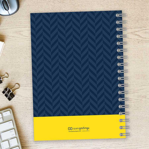SparkGreetings® Herringbone Mood Writing Journal, blue and dark blue herringbone patterned cover with yellow band at the bottom.
