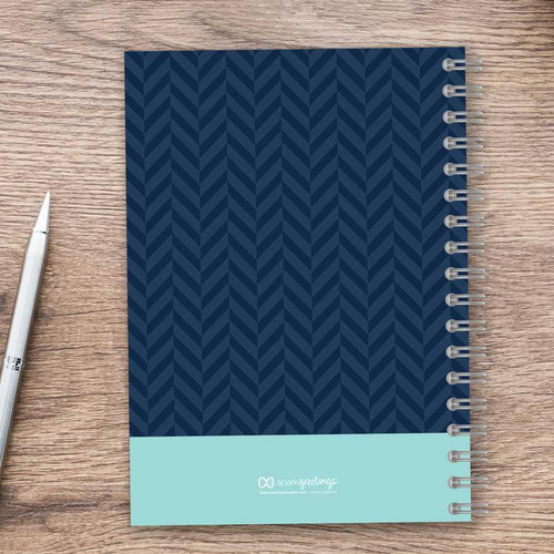SparkGreetings® Small Anchor Writing Journal, navy blue cover with a chevron pattern and a light blue base with logo on the bottom.