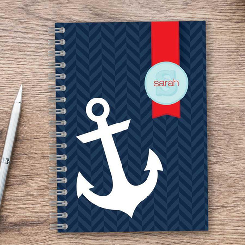 SparkGreetings® Small Anchor Writing Journal, navy blue cover with a white anchor illustration and a red bookmark with personalized name 'Sarah' on it.