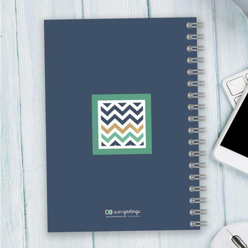SparkGreetings® Blue Chevron Writing Journal, stylish notebook with a blue cover featuring a colorful chevron pattern in a square on the front.