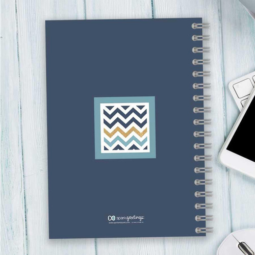 SparkGreetings® Blue Chevron Writing Journal, spiral-bound notebook with a blue cover featuring a white, navy, and gold chevron pattern in the center.