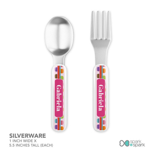 Spark & Spark Macaron Party Kids Bowl, colorful silverware with branded handles featuring macarons and rainbow stripes in a playful design.