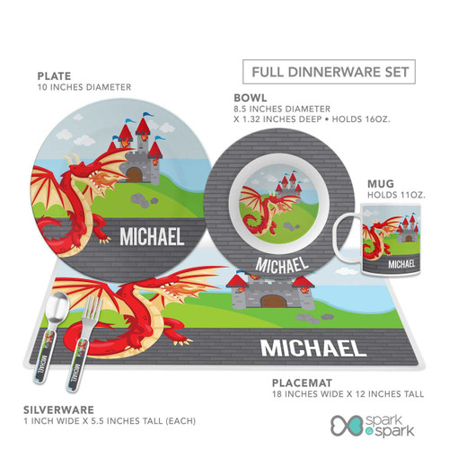 Spark & Spark Dragon Quest Kids Bowl, featuring a colorful design with a dragon and castle motif, part of a full dinnerware set including a plate, bowl, mug, placemat, and silverware, all personalized with the name 'Michael'.