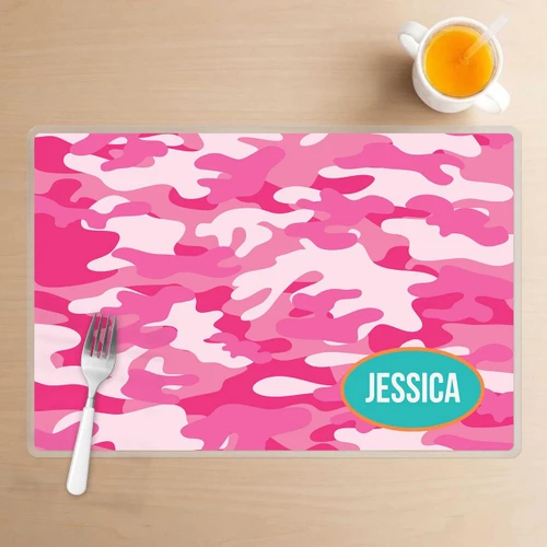 Spark & Spark Pink Camouflage Kids Placemat, pink camouflage pattern with a personalized name Jessca in a blue oval.