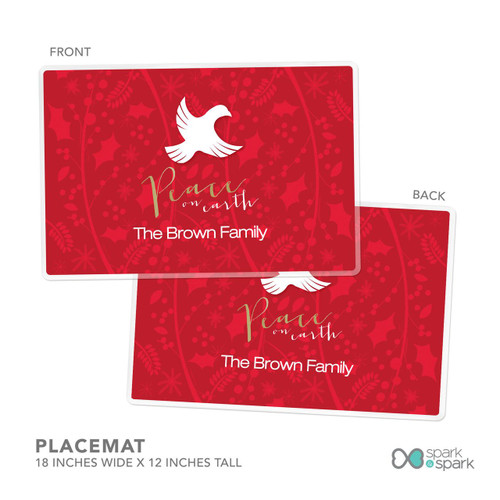 Spark & Spark Peace On Earth Holiday Placemat, front and back view of a red holiday placemat with a white dove and festive background design.