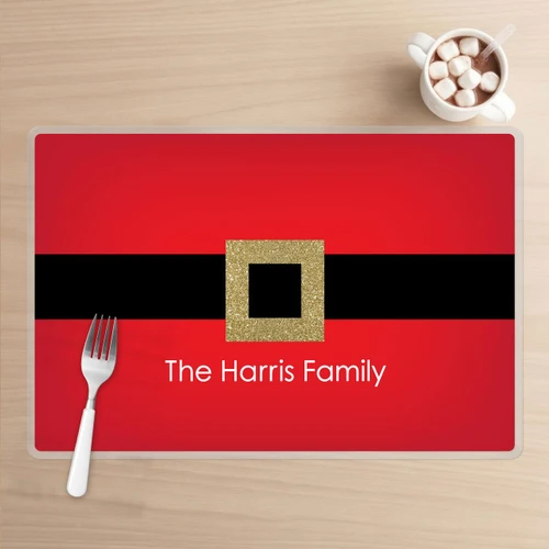 Spark & Spark Shiny Santa's Belt Buckle Holiday Placemat, festive red placemat with a black belt design and a gold glittery belt buckle, personalized with the text 'The Harris Family'.