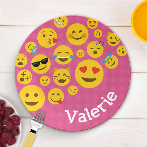Personalized kids plate with colorful emoji faces on pink background and name Valerie