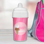 Spark & Spark Sweet & Yummy Pink Sippy Cup, pink plastic cup with white lid and straw, personalized with the name Nicole Emma, next to a pink backpack.
