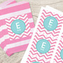SparkGreetings® Chevron Pink & Aqua Gift Label Set, personalized gift tags with pink and white chevron pattern and a blue circle with initial 'E' and name 'Emily' on each label.