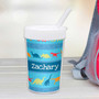 Spark & Spark Dinosaur Trails Toddler Cup, personalized blue cup with colorful dinosaur illustrations and the name Zachary.