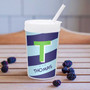 Spark & Spark Brilliant Initial Blue Toddler Cup, a personalized kids' cup with a T design and the name Thomas, on a wooden surface with blackberries around it.