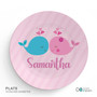 Spark & Spark Whales in Love Kids Plates, pink round plate featuring a cute design of a blue and a pink whale with hearts above their heads and the name 'Samantha' written below.