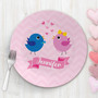 Spark & Spark Sweet & Cute Birds Kids Placemat, pink round placemat with cartoon blue and pink birds, hearts, and the name Jennifer in a pink banner.