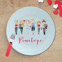 Spark & Spark Group of Love Kids Placemat, illustrated characters holding hearts, on a wooden table with scattered heart shapes