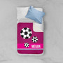 Spark & Spark Girl Soccer Fan Purple Sherpa Blanket with personalized name Megan, featuring soccer ball patterns in black and white on a vibrant purple background, laid out on a bed with white and blue pillows.